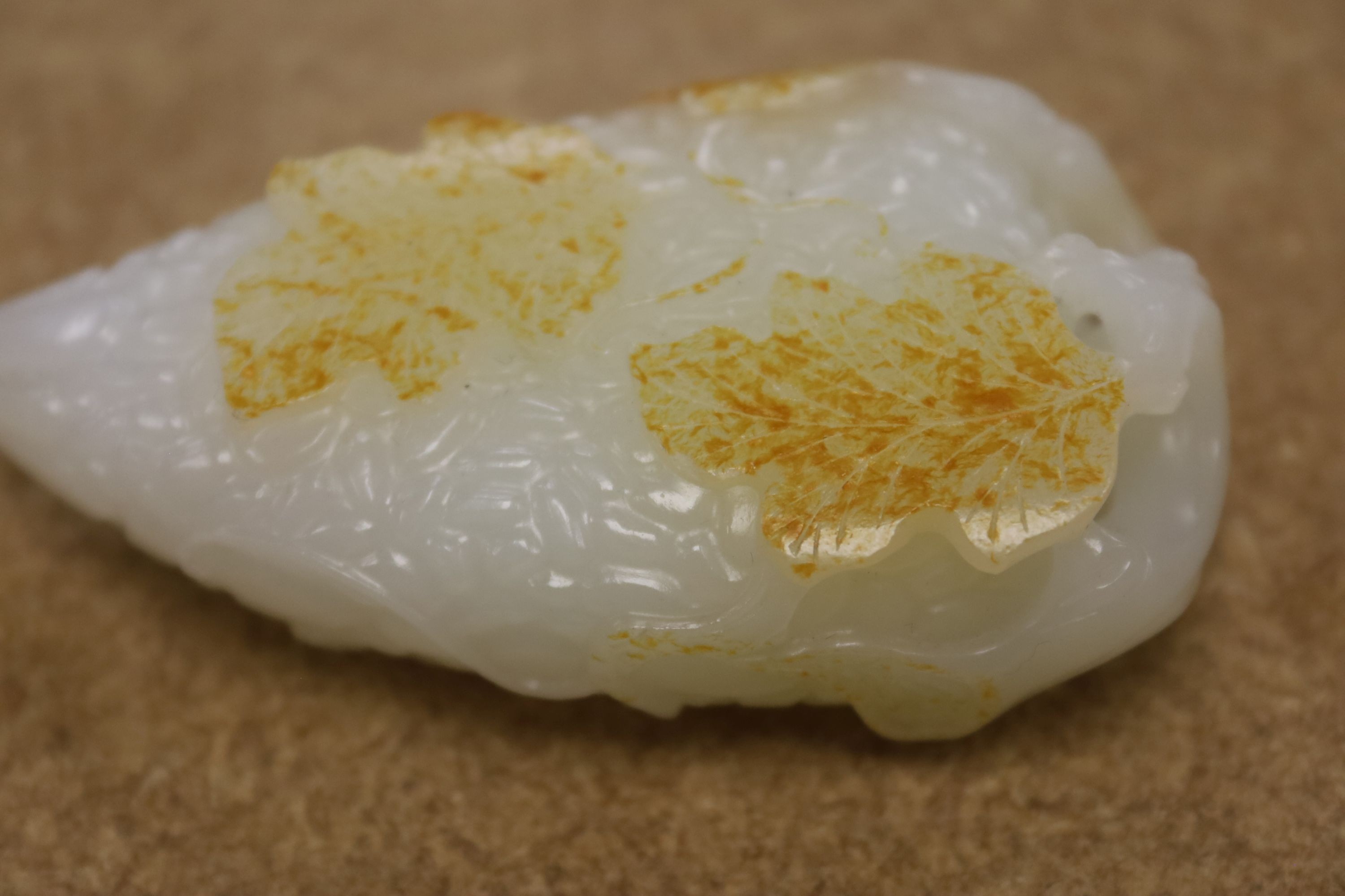 A Chinese white and russet skin jade carving, 7cm high